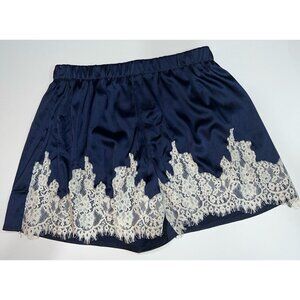 Women's navy blue shorts with white lace trim
